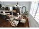 Dining area features dark cabinets, backsplash and a table with four chairs at 153 Via Di Mello, Henderson, NV 89011