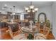 Cozy dining area with a round table, stylish chairs, and a decorative chandelier at 153 Via Di Mello, Henderson, NV 89011