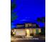 Nighttime exterior showing the well lit, inviting home at 153 Via Di Mello at 153 Via Di Mello, Henderson, NV 89011