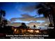 Evening view of a peaceful gated neighborhood with a view of the Las Vegas strip at 153 Via Di Mello, Henderson, NV 89011