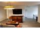 Upstairs loft with balcony access featuring a large TV and stylish furnishings at 153 Via Di Mello, Henderson, NV 89011