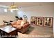 Spacious loft area with exercise equipment, furniture, and unique artwork at 153 Via Di Mello, Henderson, NV 89011
