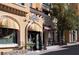 Charming storefront with colorful awnings and outdoor seating, inviting customers to enjoy a delightful shopping experience at 153 Via Di Mello, Henderson, NV 89011