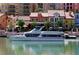 Picturesque waterfront view featuring a luxurious yacht docked near colorful buildings, enhancing the vibrant scenery at 153 Via Di Mello, Henderson, NV 89011