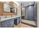 Bathroom with double sinks, modern vanity, and a stylish glass-enclosed shower at 1601 Eaton Dr, Las Vegas, NV 89102