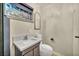 Bathroom with modern vanity and countertop, toilet, and neutral color palette at 1601 Eaton Dr, Las Vegas, NV 89102