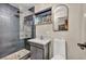 Bathroom featuring modern shower with glass and stone floor, toilet, and vanity at 1601 Eaton Dr, Las Vegas, NV 89102