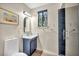 Modern bathroom boasts vanity with updated fixtures, stylish mirror, and glass enclosed shower at 1601 Eaton Dr, Las Vegas, NV 89102
