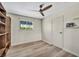 Bedroom with hardwood floors, window, ceiling fan, and a neutral color palette at 1601 Eaton Dr, Las Vegas, NV 89102