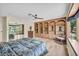 Spacious bedroom with built-in shelving, natural light, and a comfortable bed at 1601 Eaton Dr, Las Vegas, NV 89102