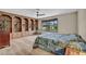 Charming bedroom with a large bed, built-in shelves, a ceiling fan, and window at 1601 Eaton Dr, Las Vegas, NV 89102