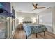 Bright bedroom with hardwood floors, ceiling fan, and comfortable queen bed at 1601 Eaton Dr, Las Vegas, NV 89102