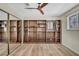Bedroom showcasing hardwood floors and wall-to-wall shelves at 1601 Eaton Dr, Las Vegas, NV 89102