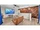 Relaxing bonus room boasts custom wood accent wall, modern lighting, and neutral color palette at 1601 Eaton Dr, Las Vegas, NV 89102