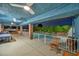 View of the covered patio, with outdoor kitchen overlooking the swimming pool at dusk at 1601 Eaton Dr, Las Vegas, NV 89102