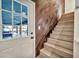 Entryway with stairs, wooden accent wall, and views of the pool through the door at 1601 Eaton Dr, Las Vegas, NV 89102
