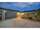 Night exterior shot of the home featuring a two-car garage and desert landscaping at 1601 Eaton Dr, Las Vegas, NV 89102