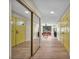 Bright hallway featuring wood floors, mirrored closet, and doors leading to other rooms at 1601 Eaton Dr, Las Vegas, NV 89102
