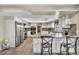 Bright kitchen with white cabinets, granite counters, stainless appliances and eat-in breakfast bar at 1601 Eaton Dr, Las Vegas, NV 89102