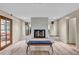 Bright living room features a charming brick fireplace, stylish bench, and well-lit modern interior at 1601 Eaton Dr, Las Vegas, NV 89102