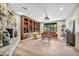 Spacious living room with stone fireplace, built-in shelving, and hardwood floors at 1601 Eaton Dr, Las Vegas, NV 89102
