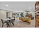Open living room boasts hardwood floors, modern furnishings, and an adjacent kitchen and dining area at 1601 Eaton Dr, Las Vegas, NV 89102