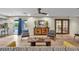 Cozy living room featuring wood floors, elegant decor, and a view of the pool at 1601 Eaton Dr, Las Vegas, NV 89102