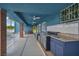 Covered patio with an outdoor kitchen features a gas grill and bar with sink at 1601 Eaton Dr, Las Vegas, NV 89102
