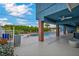 View of the covered patio looking towards the pool and lush landscaped yard at 1601 Eaton Dr, Las Vegas, NV 89102