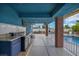 Covered patio with an outdoor kitchen overlooks the pool with sunbathing area at 1601 Eaton Dr, Las Vegas, NV 89102