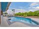 Large swimming pool surrounded by mature hedges and sunbathing area at 1601 Eaton Dr, Las Vegas, NV 89102