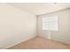 This bedroom has neutral walls and carpet with a window at 199 Bailey Island Dr, Henderson, NV 89074