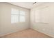 Bedroom with neutral carpet, blank walls and two windows, ready to be furnished at 199 Bailey Island Dr, Henderson, NV 89074