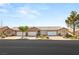 A street view shows multiple well-maintained townhomes, each with a two-car garage and tidy landscaping at 199 Bailey Island Dr, Henderson, NV 89074