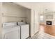 Bright laundry room with washer and dryer near the Living Room at 199 Bailey Island Dr, Henderson, NV 89074