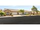 Street view of a row of attractive townhomes with well-kept front yards and two-car garages at 199 Bailey Island Dr, Henderson, NV 89074