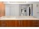Bathroom featuring wood cabinets, modern fixtures, and a large mirror at 200 W Sahara Ave # 1703, Las Vegas, NV 89102
