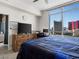 Cozy bedroom with a spacious layout, dresser, and city view window at 200 W Sahara Ave # 1703, Las Vegas, NV 89102