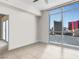 Bedroom with city views and doorway to adjacent room at 200 W Sahara Ave # 1703, Las Vegas, NV 89102
