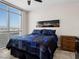 Bright bedroom featuring floor-to-ceiling windows with stunning views and modern decor at 200 W Sahara Ave # 1703, Las Vegas, NV 89102