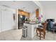 Modern kitchen featuring stainless steel appliances, wood cabinets, and a black granite countertop island at 200 W Sahara Ave # 1703, Las Vegas, NV 89102