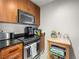 The kitchen featuring stainless steel appliances and wood cabinets at 200 W Sahara Ave # 1703, Las Vegas, NV 89102