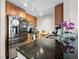 Close-up of kitchen area featuring granite countertops and stainless steel appliances at 200 W Sahara Ave # 1703, Las Vegas, NV 89102