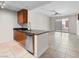 Kitchen with granite counters, stainless appliances, and bright adjacent living space at 200 W Sahara Ave # 1703, Las Vegas, NV 89102