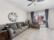 Well-lit living room with large windows and comfortable, neutral-toned furniture at 200 W Sahara Ave # 1703, Las Vegas, NV 89102