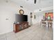 Open living space with tile floors, TV, and easy access to the kitchen area at 200 W Sahara Ave # 1703, Las Vegas, NV 89102