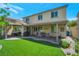 Spacious backyard with covered patio, manicured landscaping, and privacy at 205 Piedmont Alps St, Henderson, NV 89012