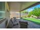 Serene backyard with covered patio and manicured lawn, perfect for outdoor relaxation at 205 Piedmont Alps St, Henderson, NV 89012