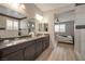 Elegant bathroom featuring a double vanity, granite countertops, and bright lighting at 205 Piedmont Alps St, Henderson, NV 89012