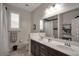 Spacious bathroom features double sinks, bright mirror, and a shower with a curtain at 205 Piedmont Alps St, Henderson, NV 89012